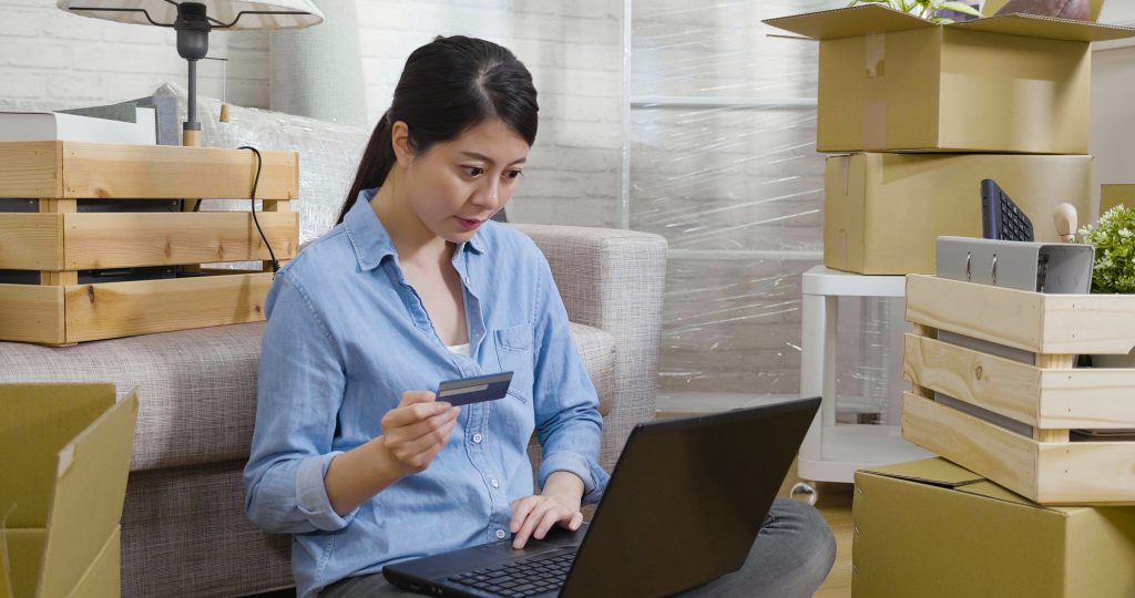 Asian Woman with packed up Furniture